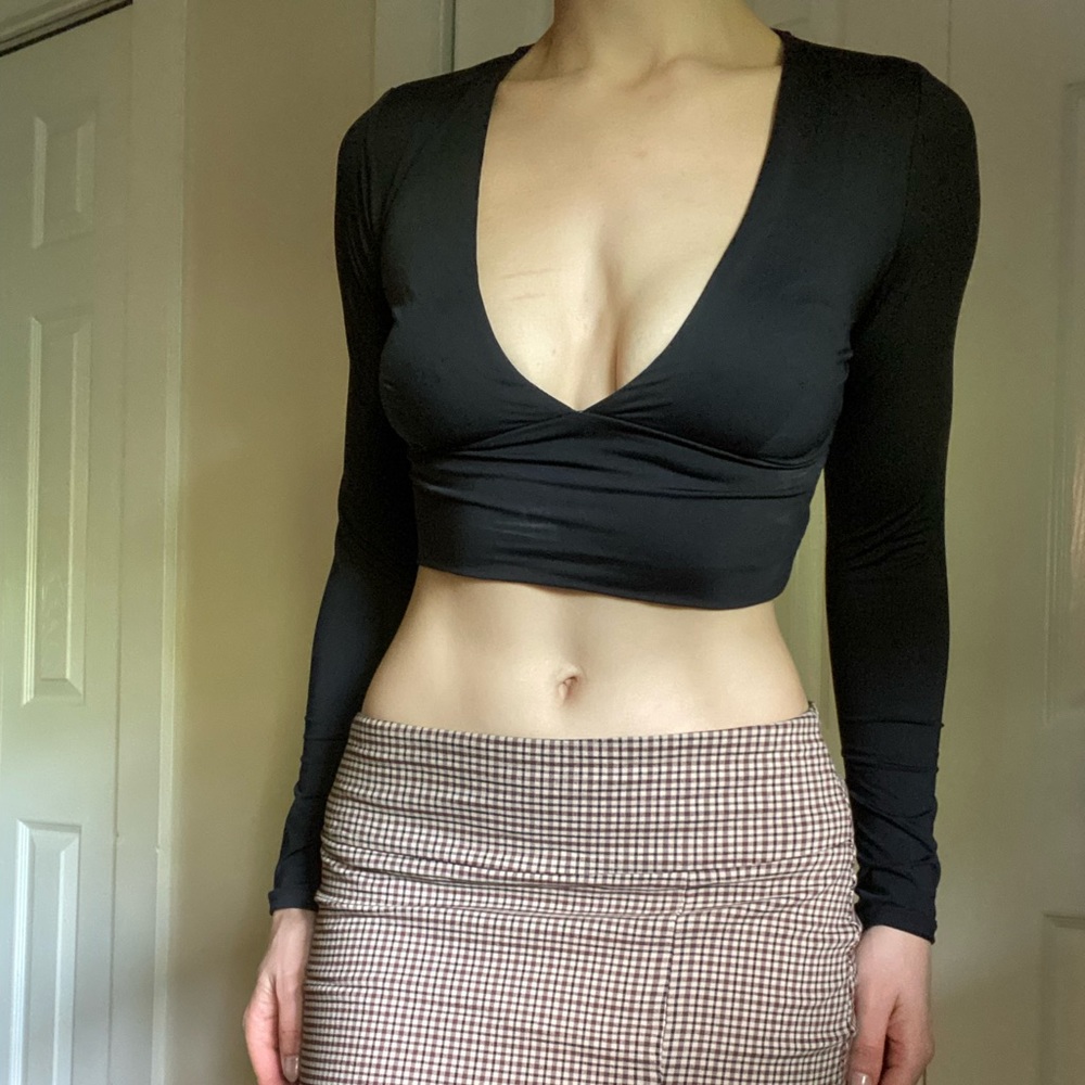 Black long sleeve crop top with deep plunge neckline